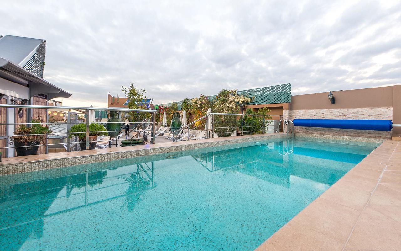 โฮเต็ล แอนด์ รย้าด อาร์ต เพลส มาราเกช Hotel มาร์ราเกช ภายนอก รูปภาพ Swimming pool at the hotel
